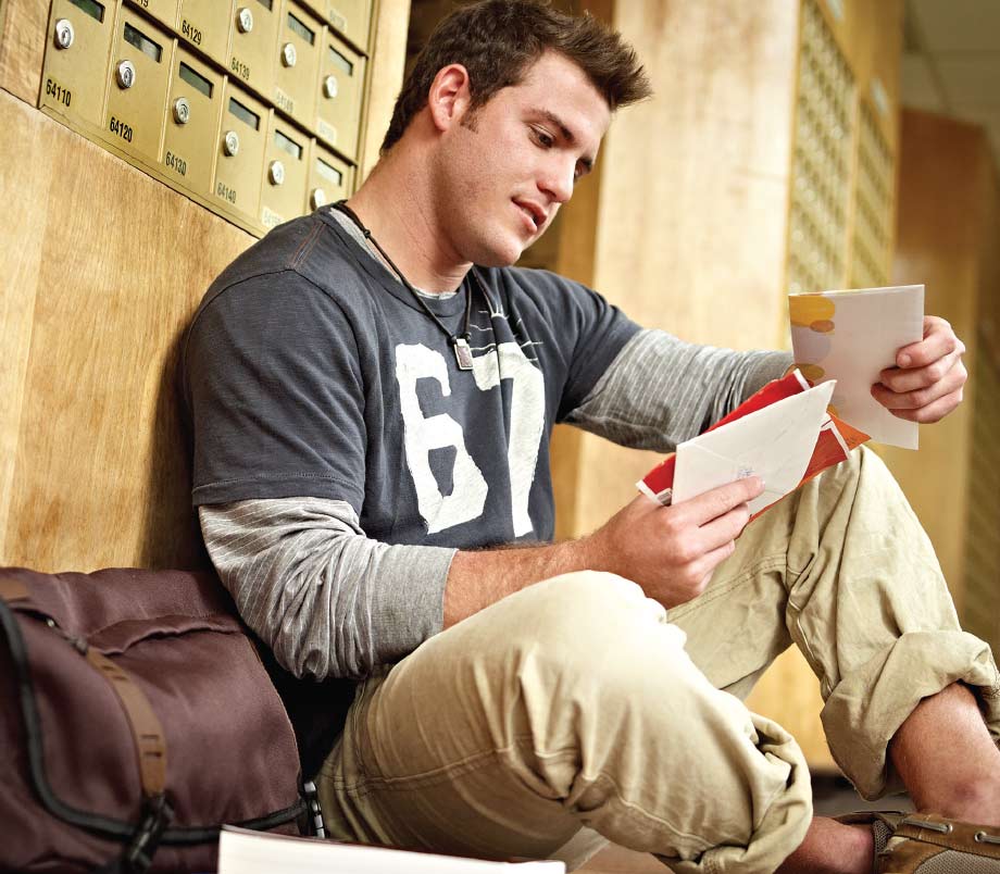 A student reading mail at The UPS Store