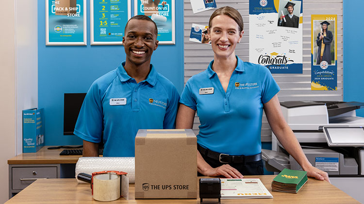 The UPS Store employees providing full service packaging solutions